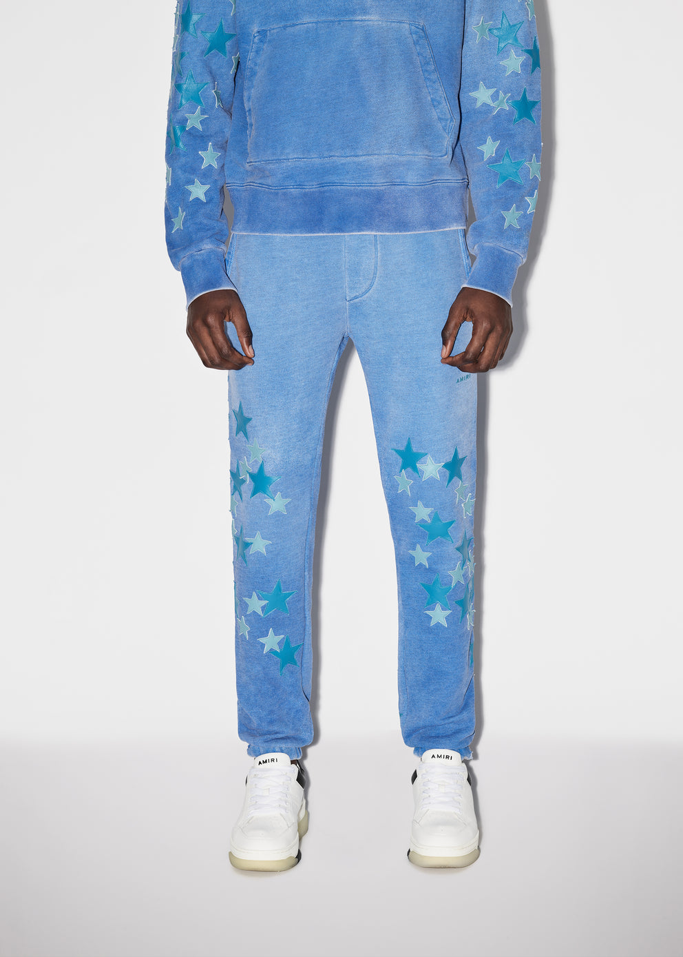 Heather Carolina Blue Amiri PIGMENT SPRAY STAR SWEATPANTS | 354879-WKF