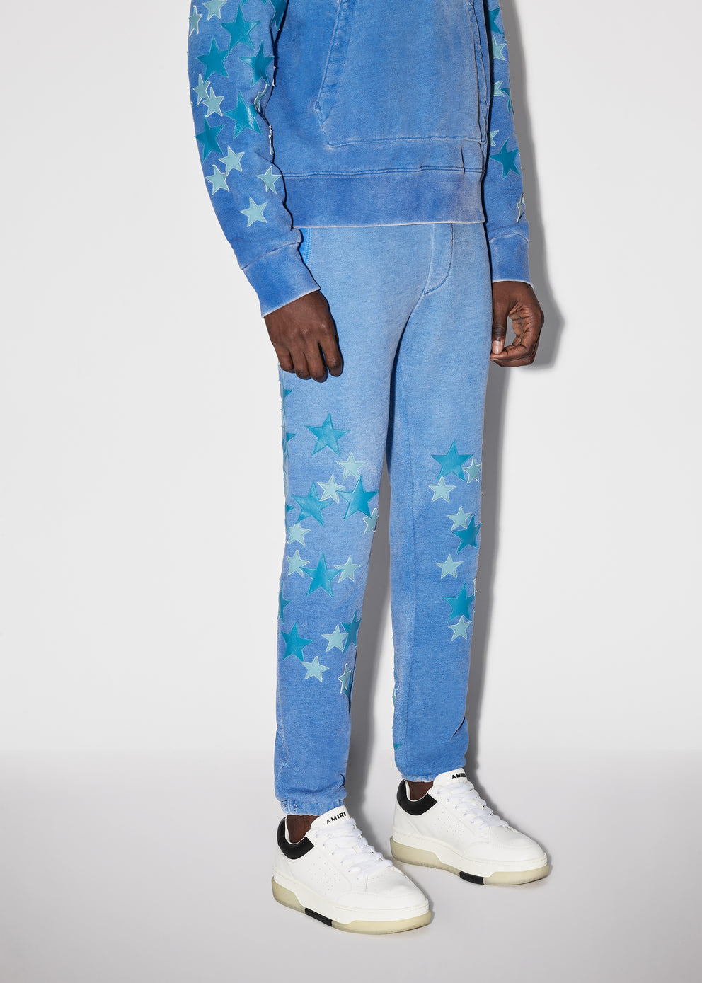 Heather Carolina Blue Amiri PIGMENT SPRAY STAR SWEATPANTS | 354879-WKF