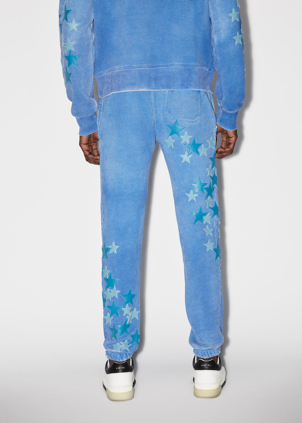 Heather Carolina Blue Amiri PIGMENT SPRAY STAR SWEATPANTS | 354879-WKF